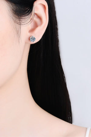 Moissanite solitaire stud earrings with rhodium finish in silver.