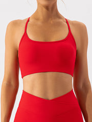 Red ribbed halterneck active bra with a scoop neckline.