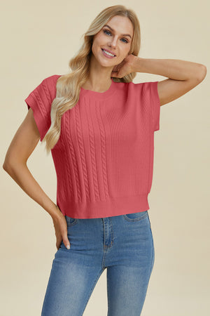 Cable knit cap sleeve pullover in strawberry with textured vertical panels.