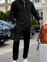 Black casual two-piece set with zippered top and track pants, men's activewear.