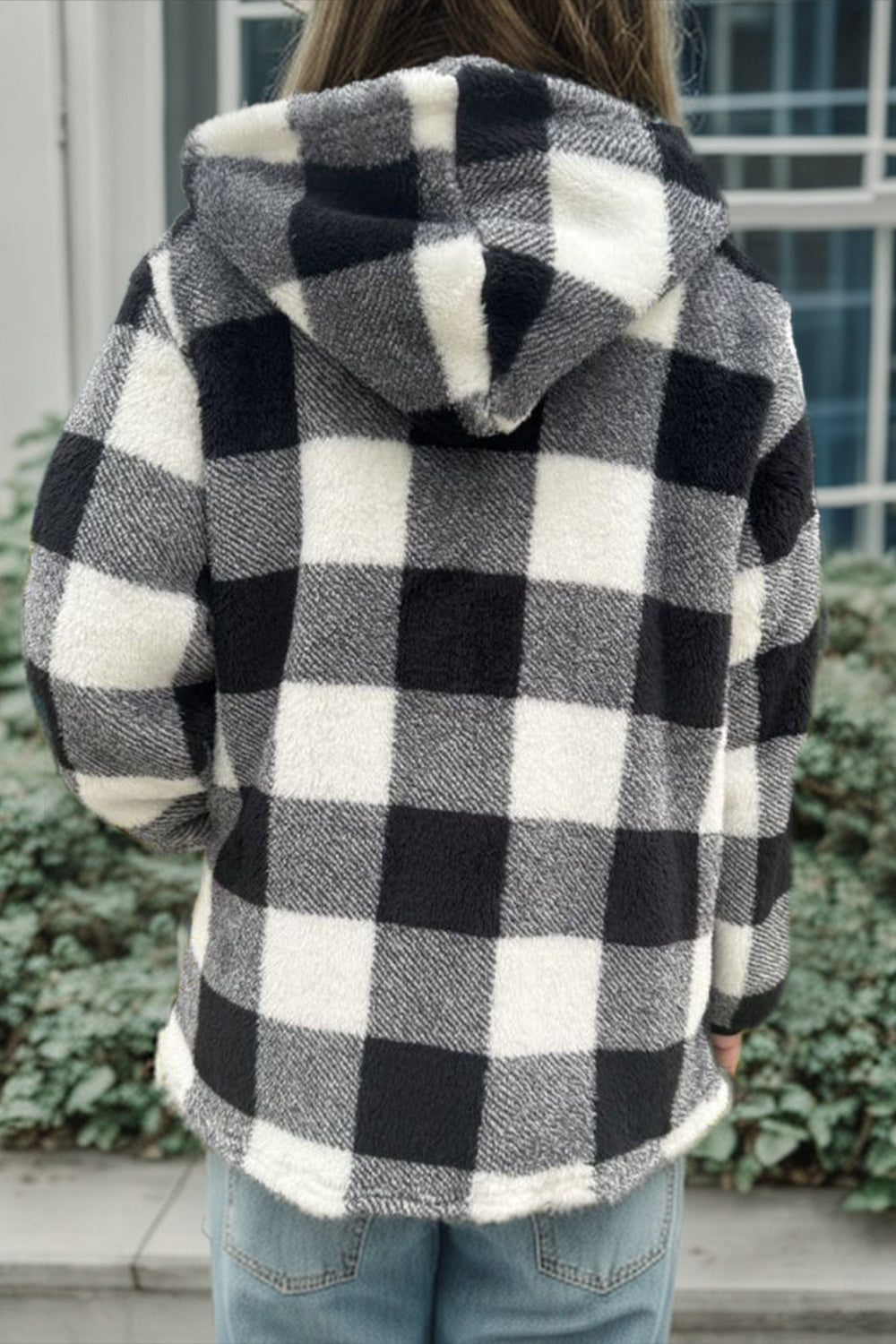 Sherpa zip-up jacket with black and white buffalo check pattern and hood.