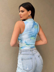 Sleeveless mock neck top with blue green tie-dye and side ruching.