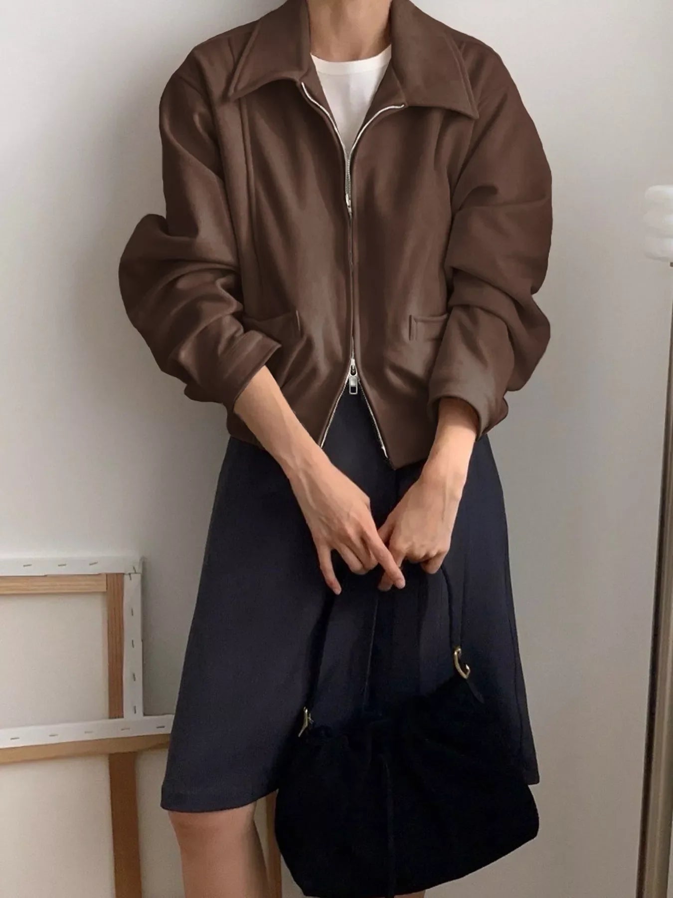 Chic brown zip-up long-sleeve jacket with a collar and pockets.