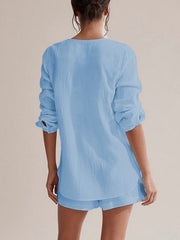 Light blue textured cotton pajama set with drawstring shorts and long sleeve top.