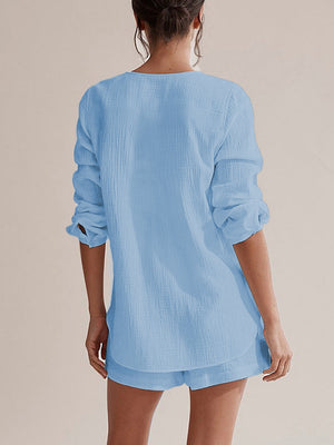 Light blue textured cotton pajama set with drawstring shorts and long sleeve top.