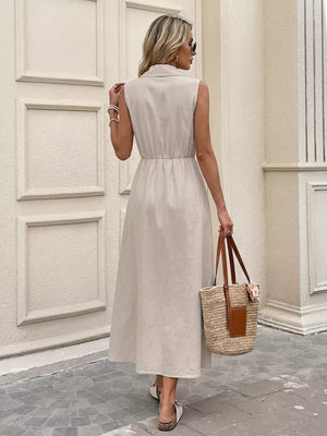 Midi dress with collared neckline, adjustable waist ties, and button-down front.