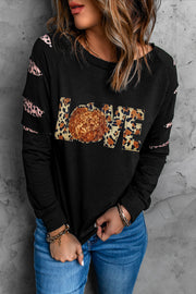 Black sweatshirt with leopard print LOVE graphic and cutout sleeves.