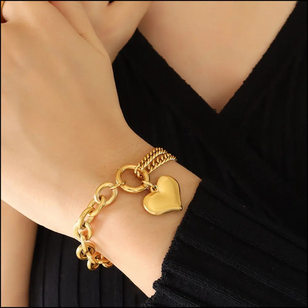 Gold heart charm bracelet with chunky chain detail