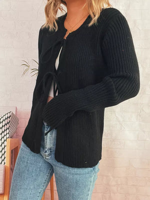 Black ribbed tie-front cardigan with cuffed sleeves and a v-neck.