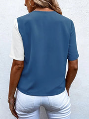 Two-tone dusty blue and white asymmetric button-down shirt with short sleeves.