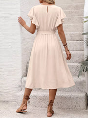 Beige midi dress with ruffled sleeves, tie waist, and button detail.