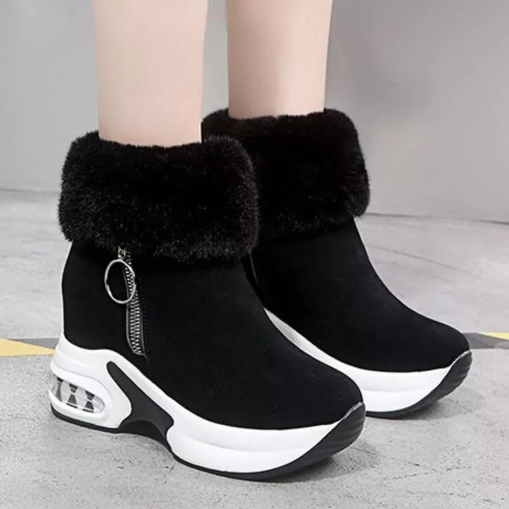Black plush side-zipper ankle boots with faux fur trim and air cushion sole.