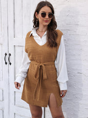 Camel knit vest dress with V-neck, tie waist, and side slit, styled with a white shirt.