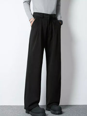 Men's black wide-leg pleated trousers with a relaxed fit and high waist.