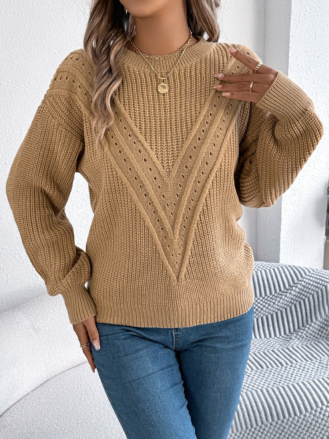 Camel chevron knit sweater with eyelet detail and crew neck.