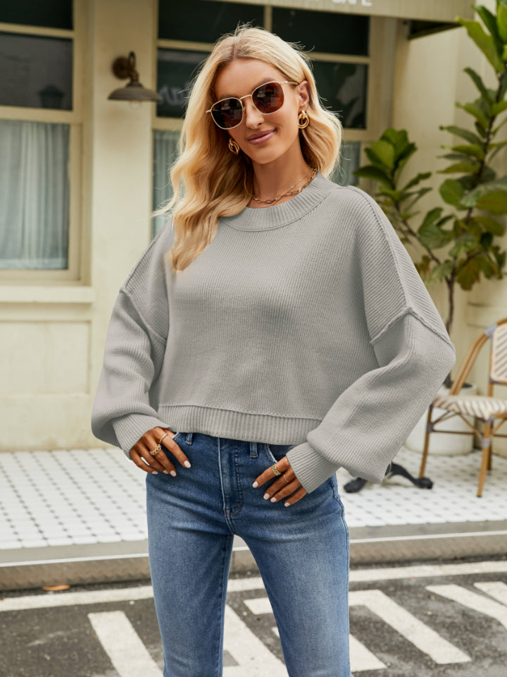 Dropped shoulder knit sweater in Heather Gray with balloon sleeves and a crew neck.