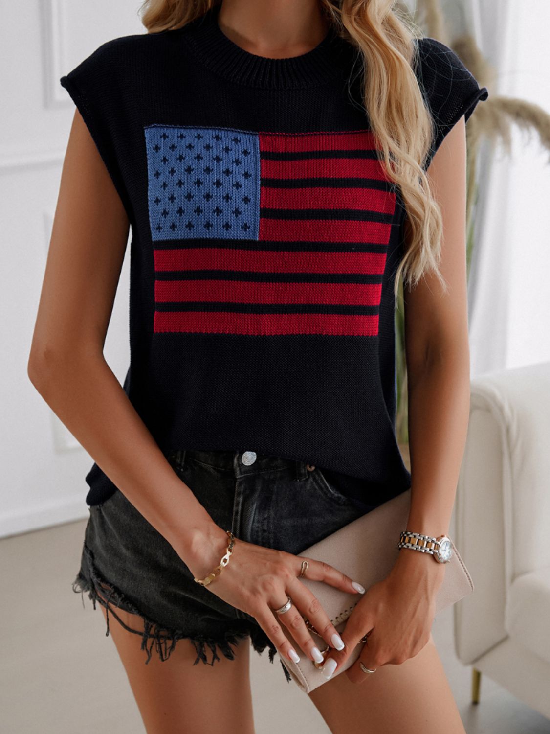 Black knit vest with American flag pattern and crew neck.