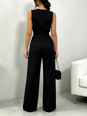 Black wide-leg belted jumpsuit with elastic waist and sleeveless design.