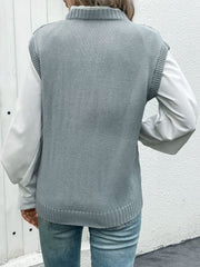 Gray acrylic diamond knit V-neck vest with ribbed trim, layered over a white shirt.