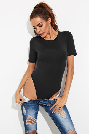 Black crew-neck jersey bodysuit with short sleeves, styled with ripped jeans.