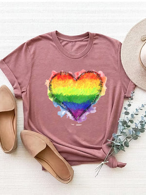 Dusty pink t-shirt with a rainbow heart graphic and watercolor accents.