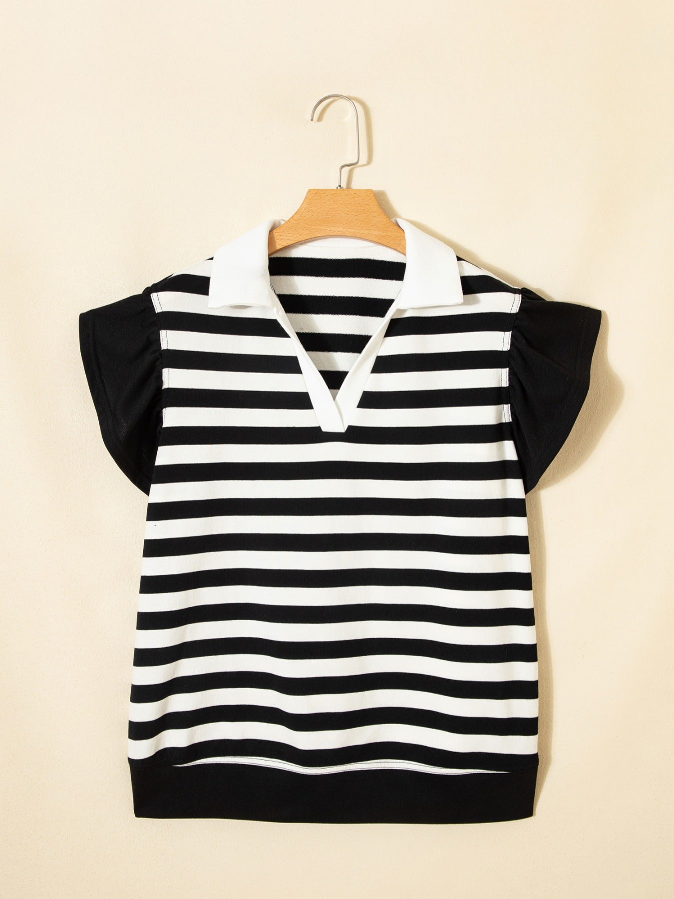Black and white striped cotton blouse with ruffled sleeves and a white collar.