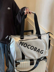 Silver leather duffel bag with black straps and "NOCOBAG" text detail.