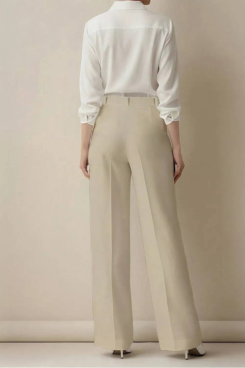 Beige high-waisted wide-leg trousers with a relaxed fit.