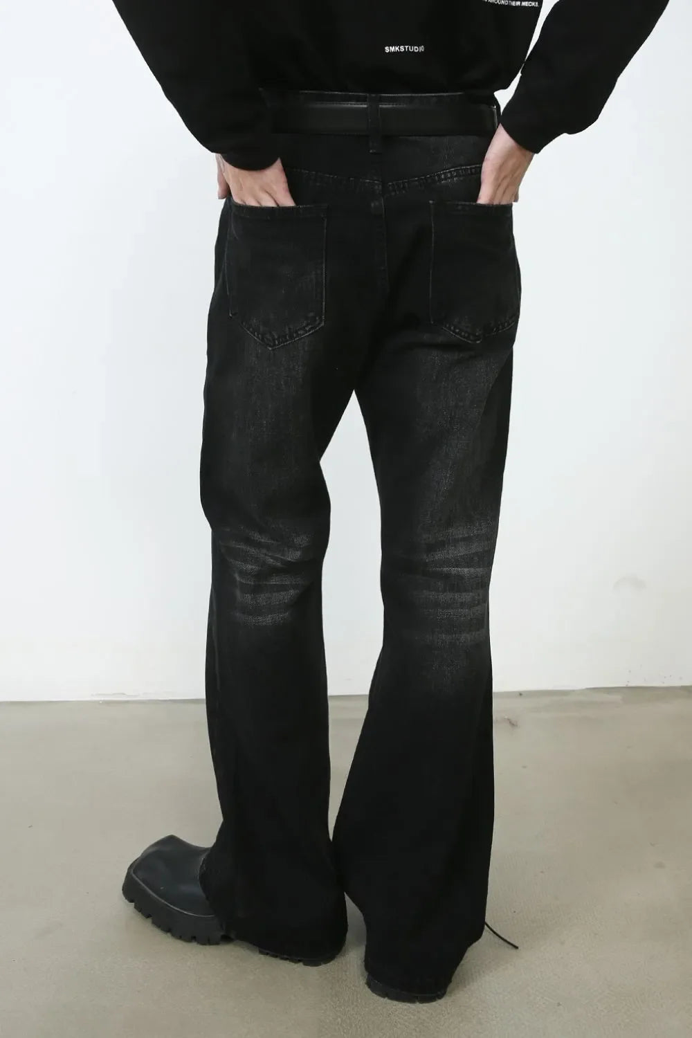 Black faded flare denim jeans with a casual, chic style.