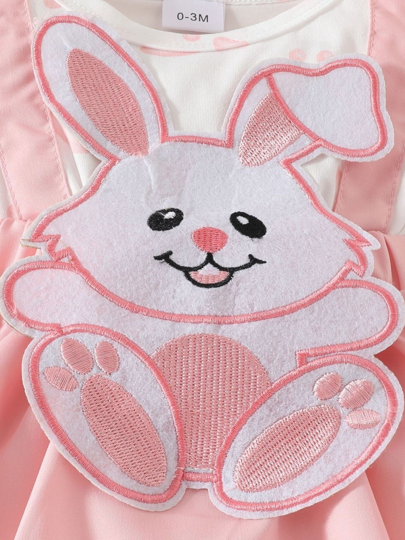 Baby dress with pink bunny applique and polka dot detail
