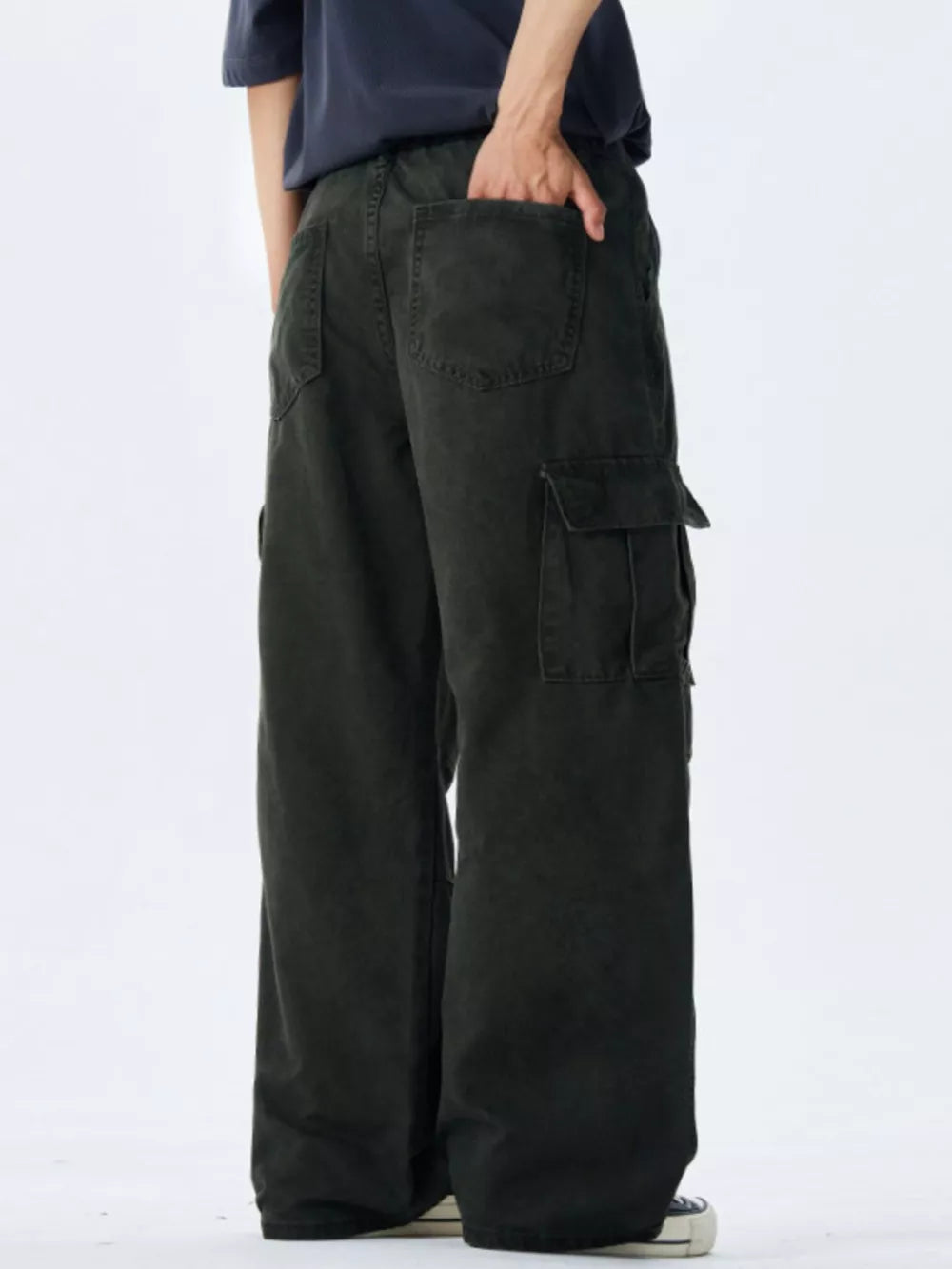 Men's black 100% cotton wide-leg cargo pants with multiple pockets.