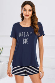 Dark blue graphic tee with "DREAM BIG" text and striped shorts pajama set.