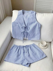 Blue striped tie-front vest and shorts set with drawstring waist and adjustable ties.