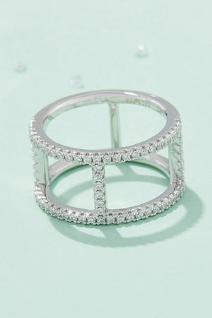 Silver geometric pave moissanite statement ring with open cage design.