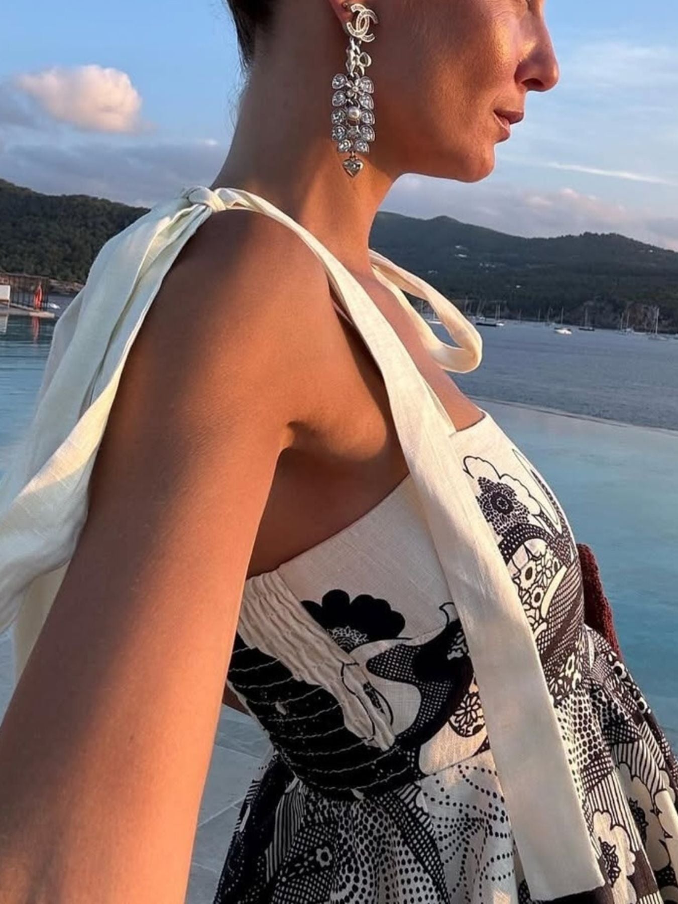 Floral tie-strap mini dress with pockets in black and white print.