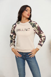 Cream crewneck sweatshirt with camouflage raglan sleeves and "COLLEGE" graphic.