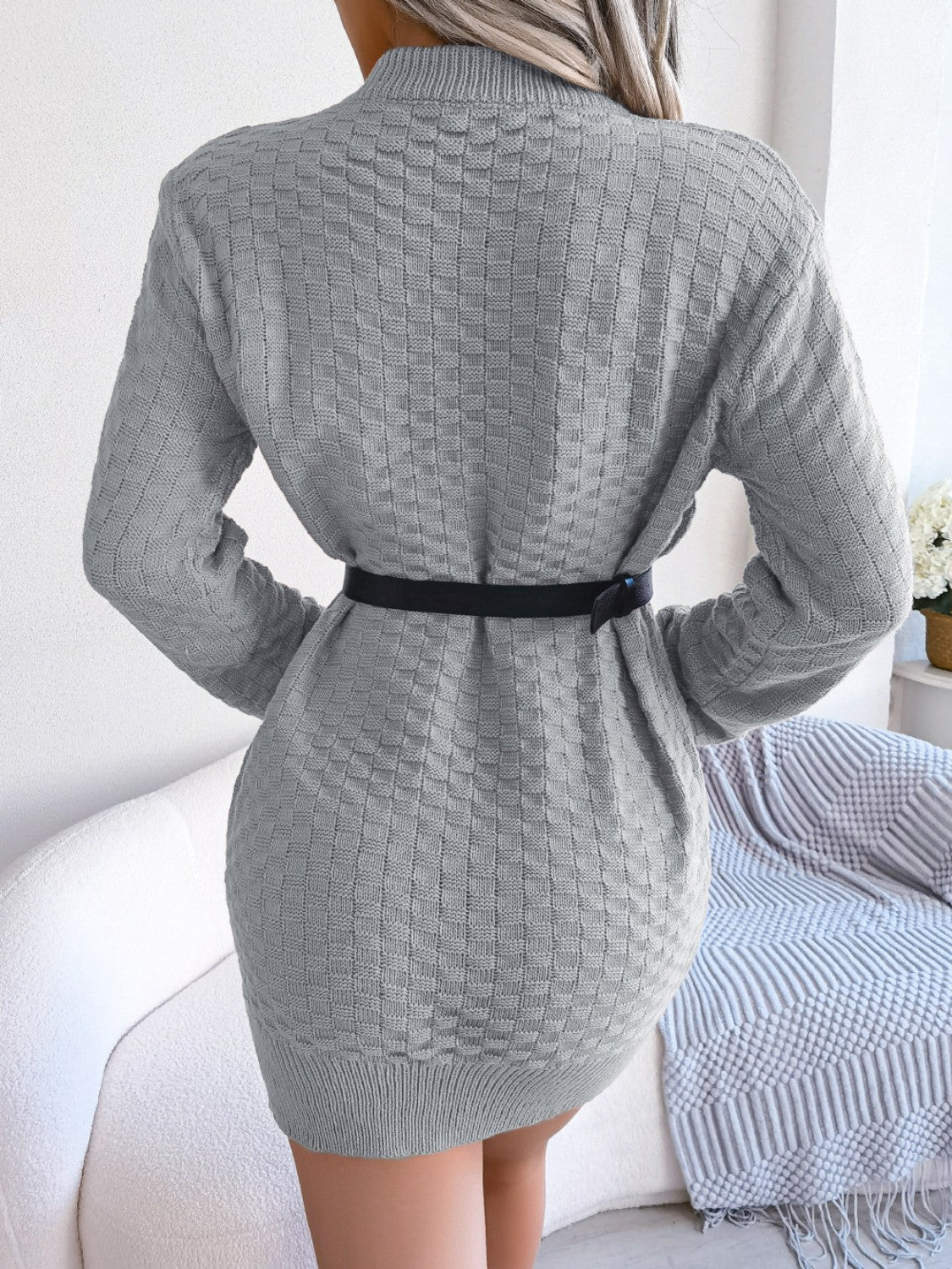 Gray textured knit bodycon mini dress with long sleeves and a black belt.
