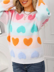 Charming heart-embellished fuzzy knit sweater with color block stripes and crew neck.