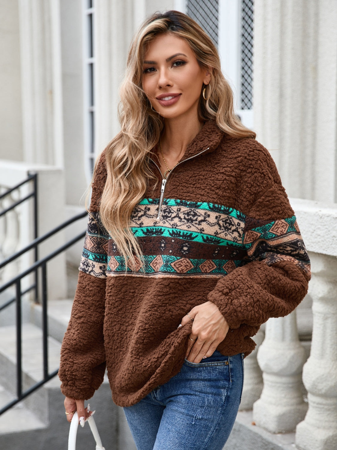 Brown sherpa quarter-zip pullover with Aztec trim and a relaxed fit.