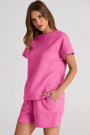 Fuchsia pink quilted tee and shorts set with geometric pattern.