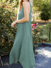 Light green asymmetrical hemline tank midi dress with a relaxed fit.