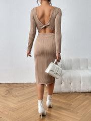 Textured tan backless midi dress with long sleeves and a twisted detail at the back.