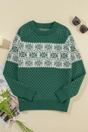 Festive Fair Isle sweater in dark green with white snowflake pattern, crew neck, long sleeves.