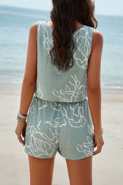 Light green viscose crop top and shorts set with abstract white print.