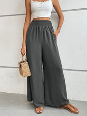 Dark Gray textured smocked waist palazzo maternity pants with wide legs.