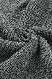Distressed knit sweater in dark gray with a plush, textured fabric detail.