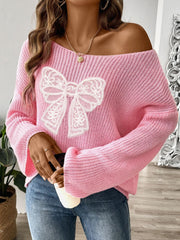 Blush pink knit sweater with off-shoulder neckline and white lace bow embellishment.
