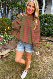 Brown waffle knit top with green stripes and contrast sleeves.