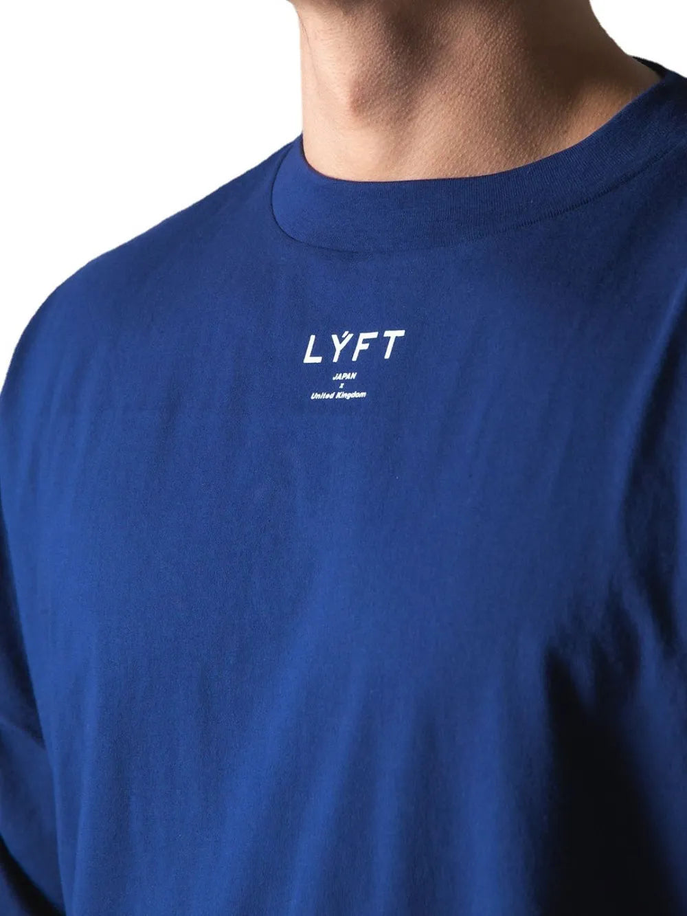 Royal blue oversized graphic tee with white text detail on chest.