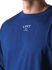 Royal blue oversized graphic tee with white text detail on chest.